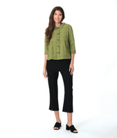 model in a slim leg black pant with a black and green striped button down blouse with 3/4 sleeves