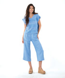 model in a blue straight leg cargo pant with a matching boxy pullover tee