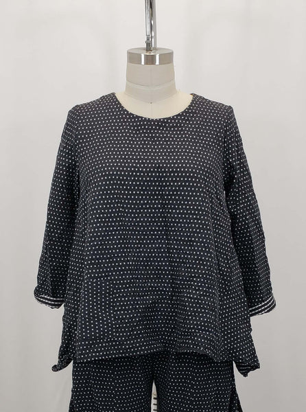 black and white dot print top with a single hip pocket, worn with a matching pant