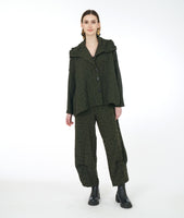 Model in a green distressed jacket with a drawstring collar, triangle buttons and pockets, with a matching wide leg pant