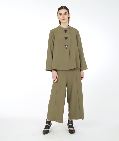 model in a wide leg sage green pant with a matching boxy button down top
