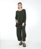 model in a wide leg distressed olive pant with a pucker at each calf, and a matching boxy top with a single pocket and a full body
