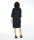 model in a distressed black shift dress with princess seams, 3/4 sleeves and hip pockets