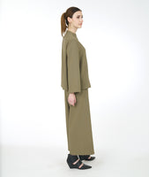 model in a wide leg sage green pant with a matching boxy button down top