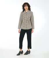 model in a slim black pant with a black and taupe stripe button down blouse with a gathered panel along the front center of the bodice