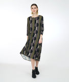 model in a green multi color stripe and dot print dress with a knot detail on one side