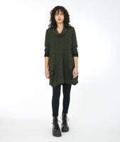 model in a green distressed tunic with long sleeves, a cowl neck, and princess seams with a pleating detail at the hips