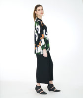 model in a wide leg black pant with a multi color paint swatch print blouse with a mandarin styler standing collar