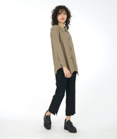 model in a pebble brown button down blouse with a slim leg black pant