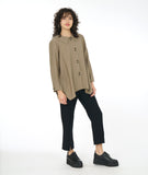 model in a pebble brown button down blouse with a slim leg black pant