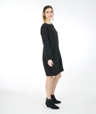 model in a black tunic with long sleeves and a curved seam at either side with set in pockets