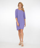 model in a light purple shift dress
