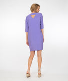 model in a light purple shift dress