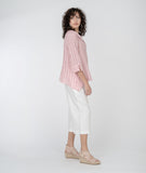 model in a wide leg white cropped pant with a red and white striped button down blouse