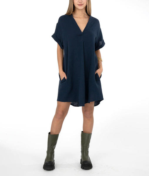 model in a boxy blue dress with a vneck
