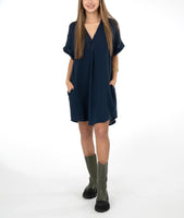 model in a boxy blue dress with a vneck