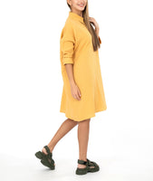model in a yellow shirt dress