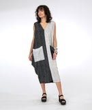 model in a black and white grid print sleeveless dress with color blocked sides and pockets
