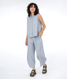 model in a white and blue pinstripe pant with a matching sleeveless top