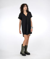 model in a boxy black dress with a vneck